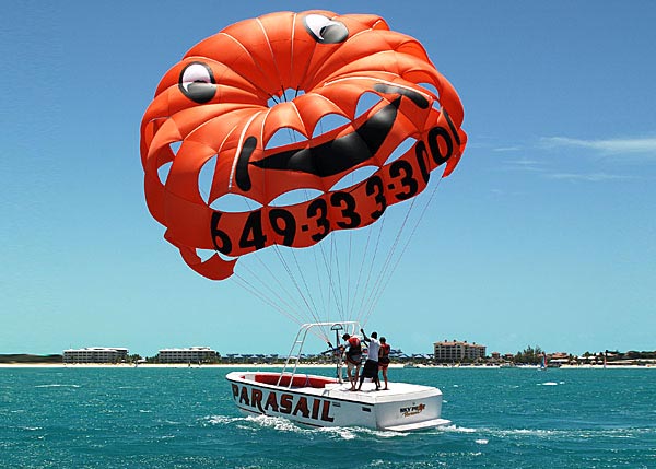 A photograph of parasailing in Grace Bay, Providenciales (Provo), Turks and Caicos Islands, British West Indies