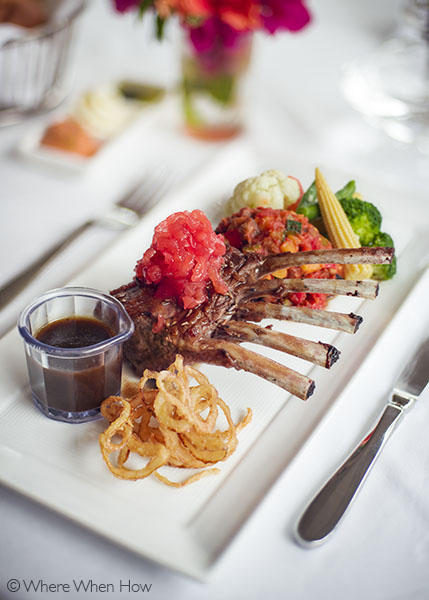 A photograph of Lavender marinated lamb rack topped with pineapple mint chutney.Grace’s Cottage, Grace Bay, Providenciales (Provo), Turks and Caicos Islands.