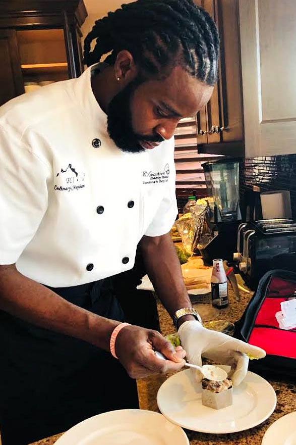 A photograph of the chef at Grandma’s Boy Kitchen and Catering, Grace Bay, Providenciales (Provo), Turks and Caicos Islands.