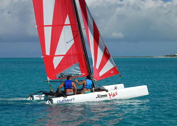 A photograph of a hobie cat sailing across Grace Bay, Providenciales (Provo), Turks and Caicos Islands